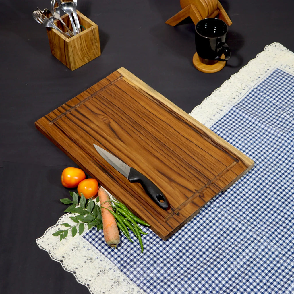 Wooden Cutting board with juice groove with a knife on a checked cloth