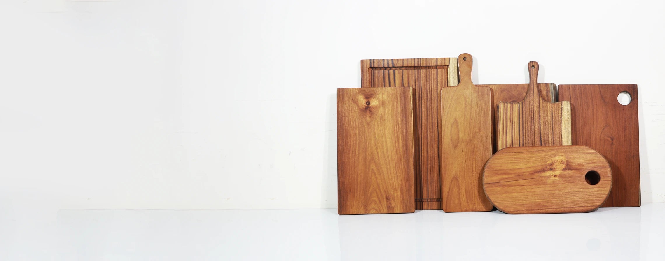 Set of wooden cutting boards on a white background