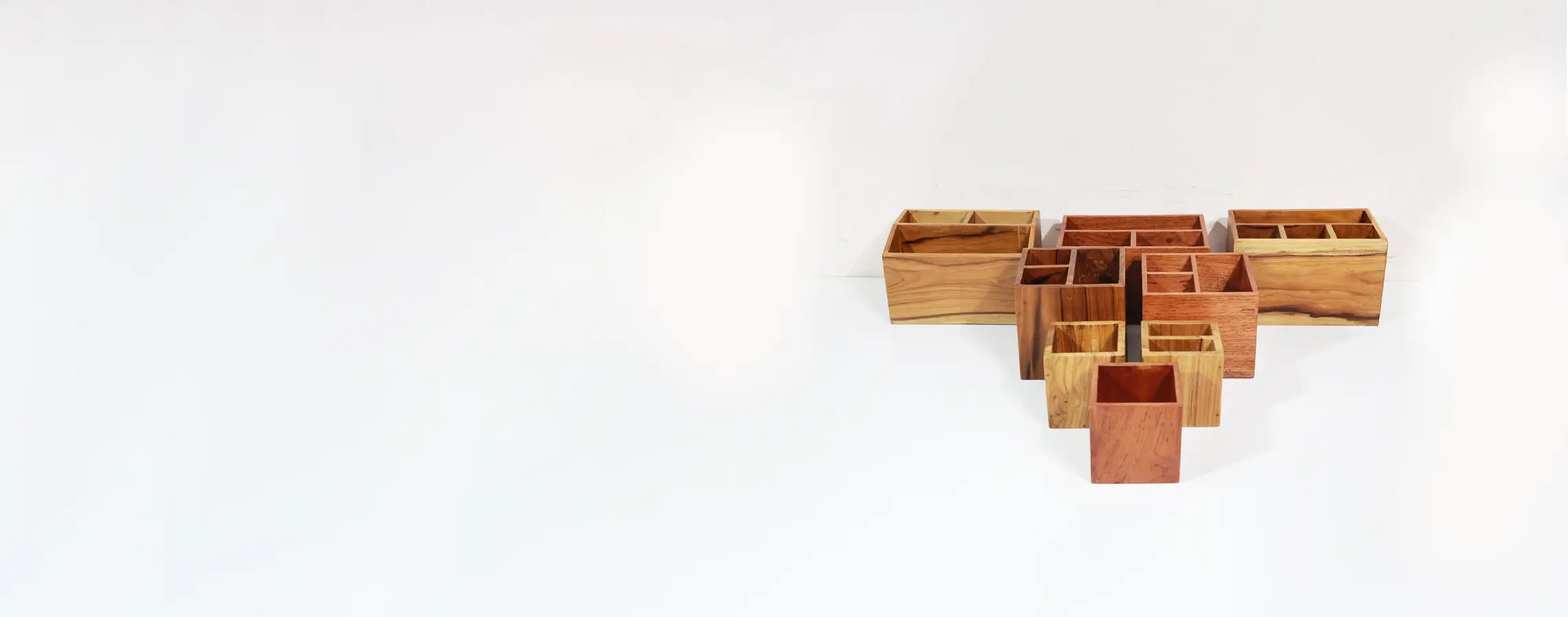 Set of wooden containers on a white background