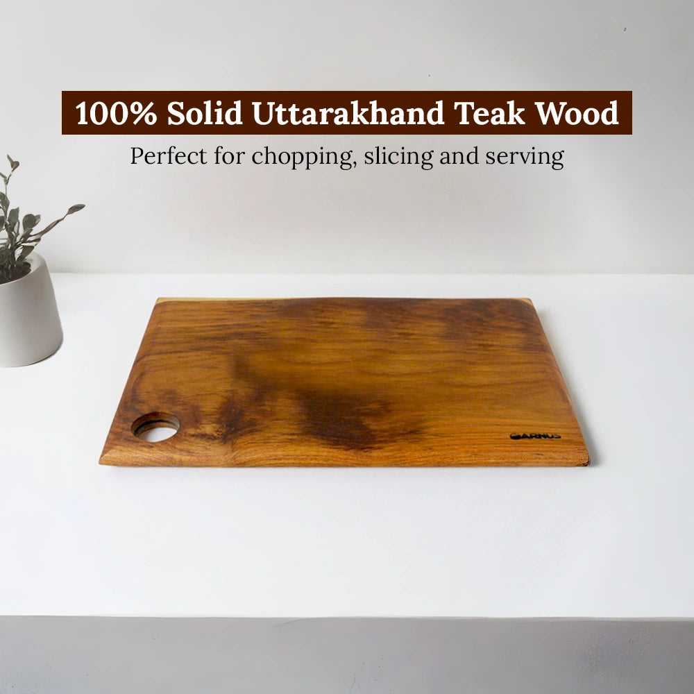 Wooden cutting board on a white surface with text about Uttarakhand teak wood.