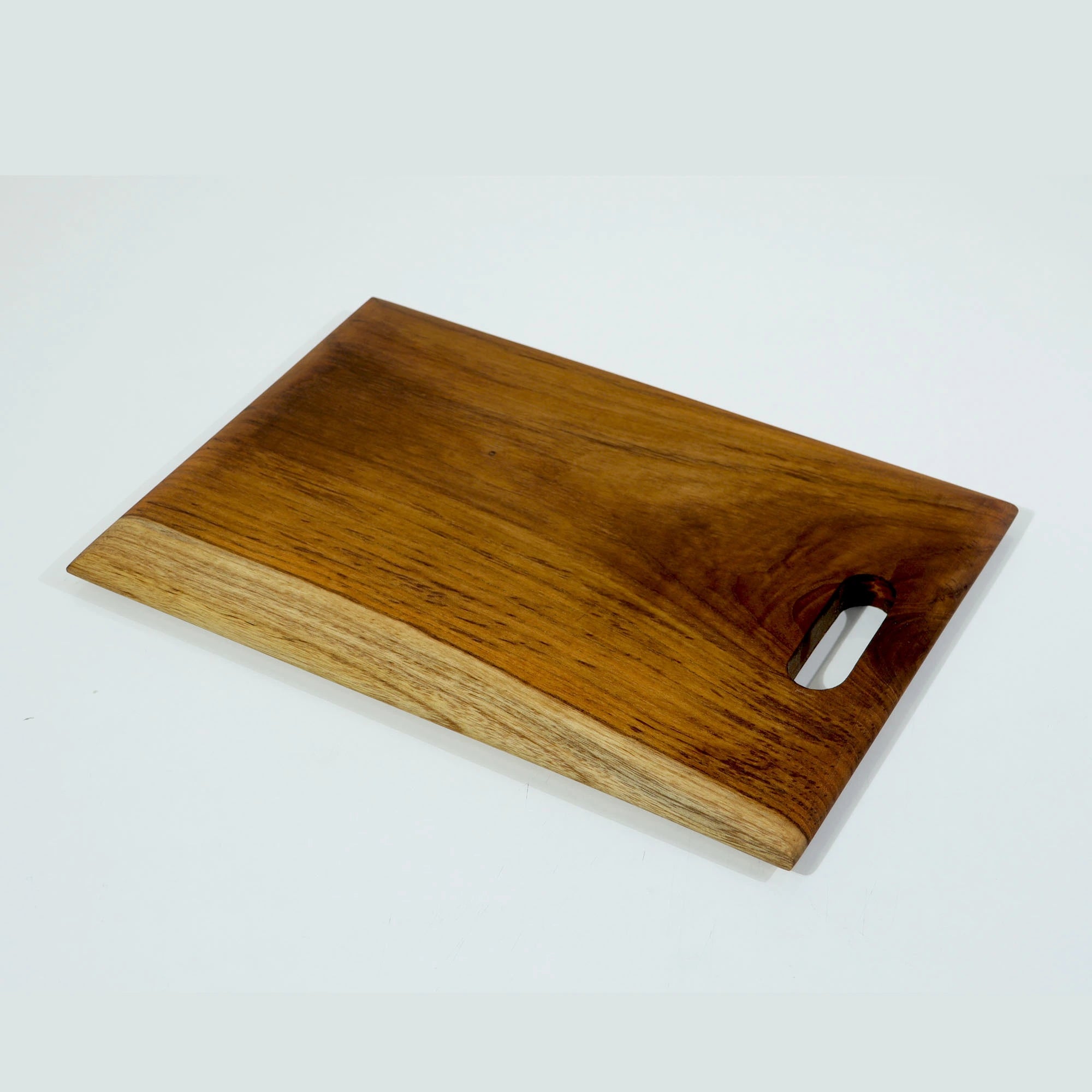 Organic Wooden chopping board with a handle on a white background