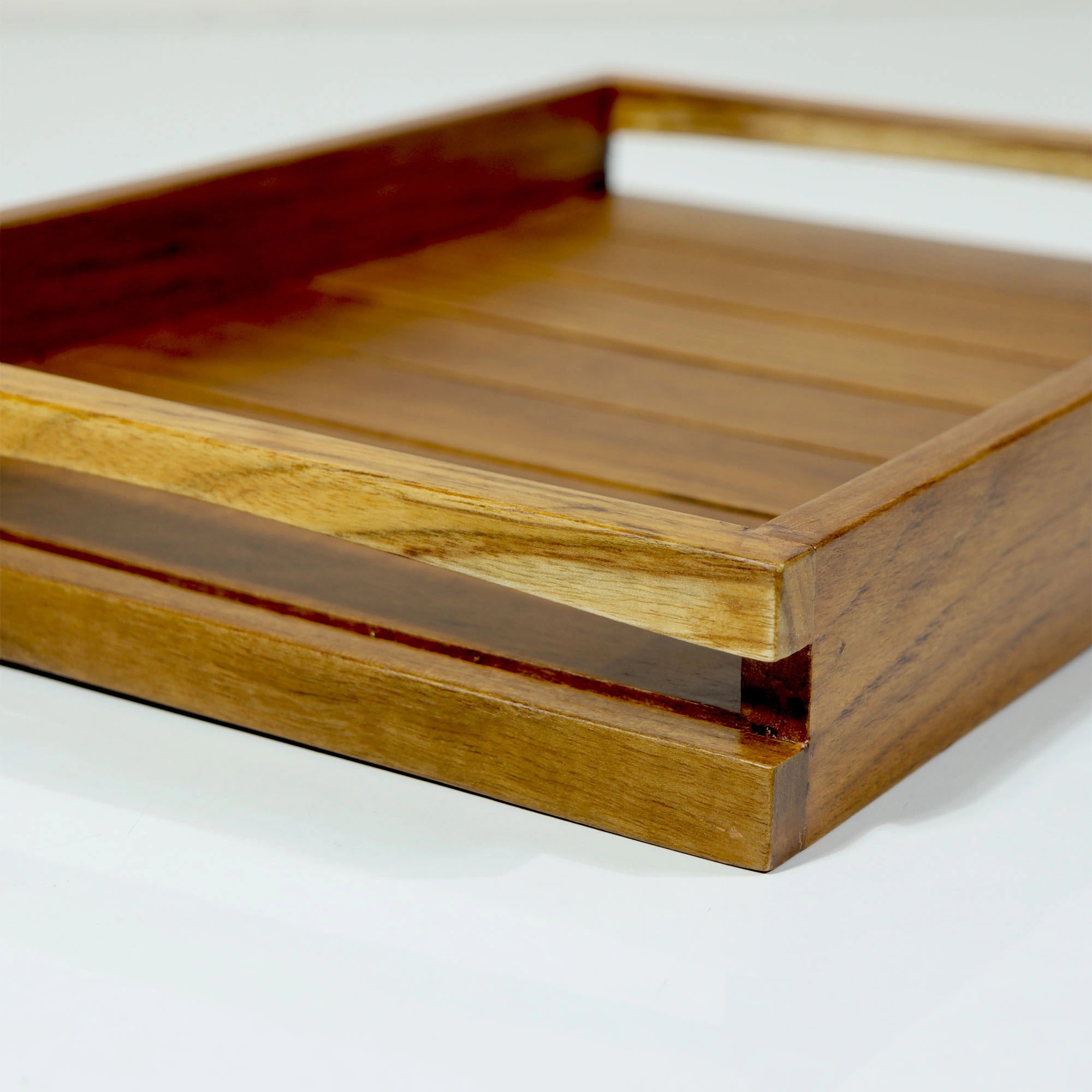 Wooden tray with a smooth finish on a white background