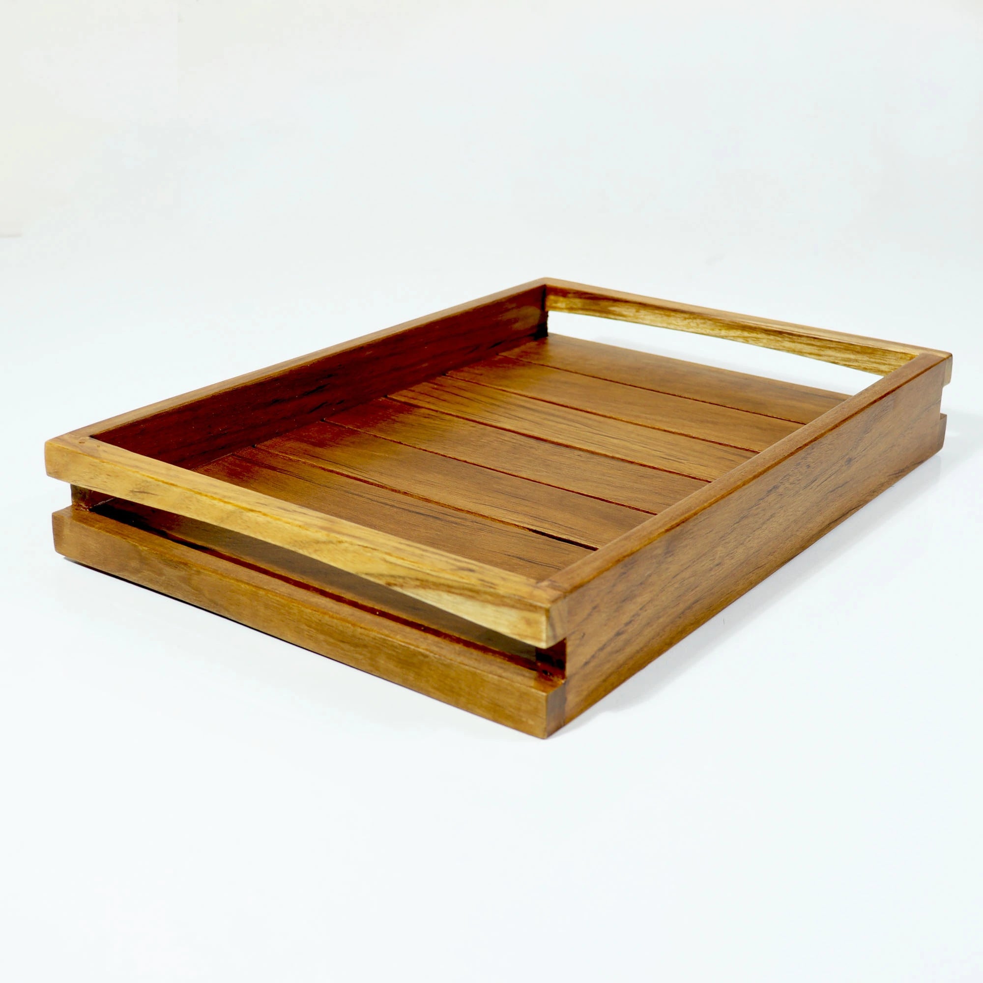 Wooden tray with a handle on a white background