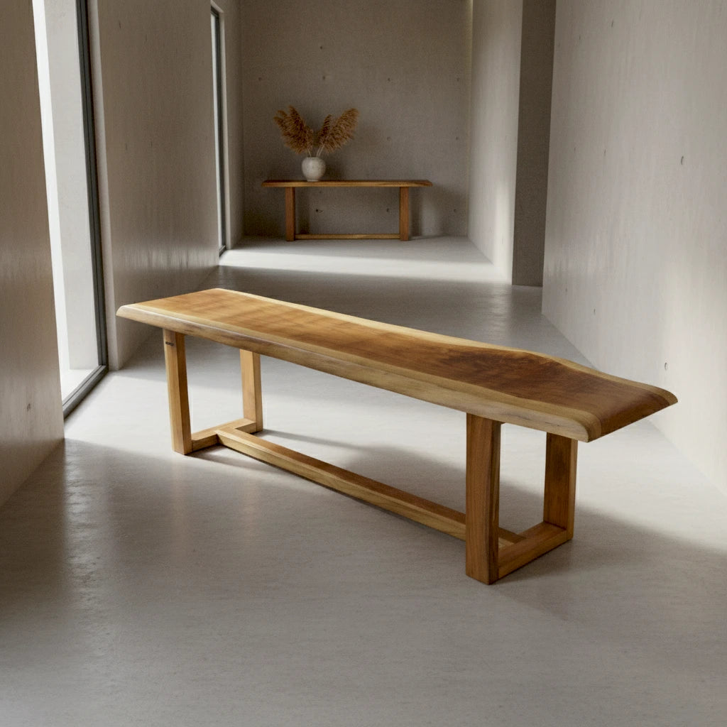 Wooden bench in a minimalistic room with a small shelf in the background.