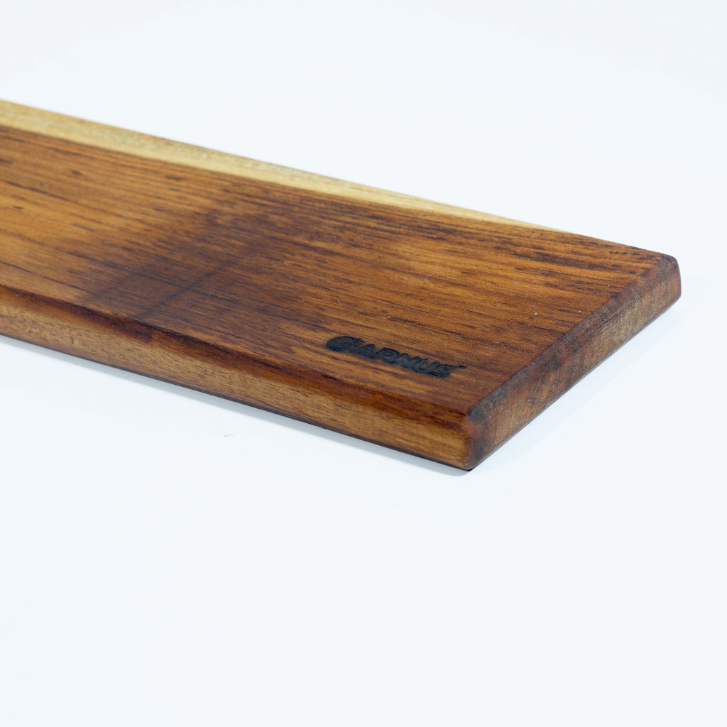 Wooden cheese board with a visible brand logo on a white background