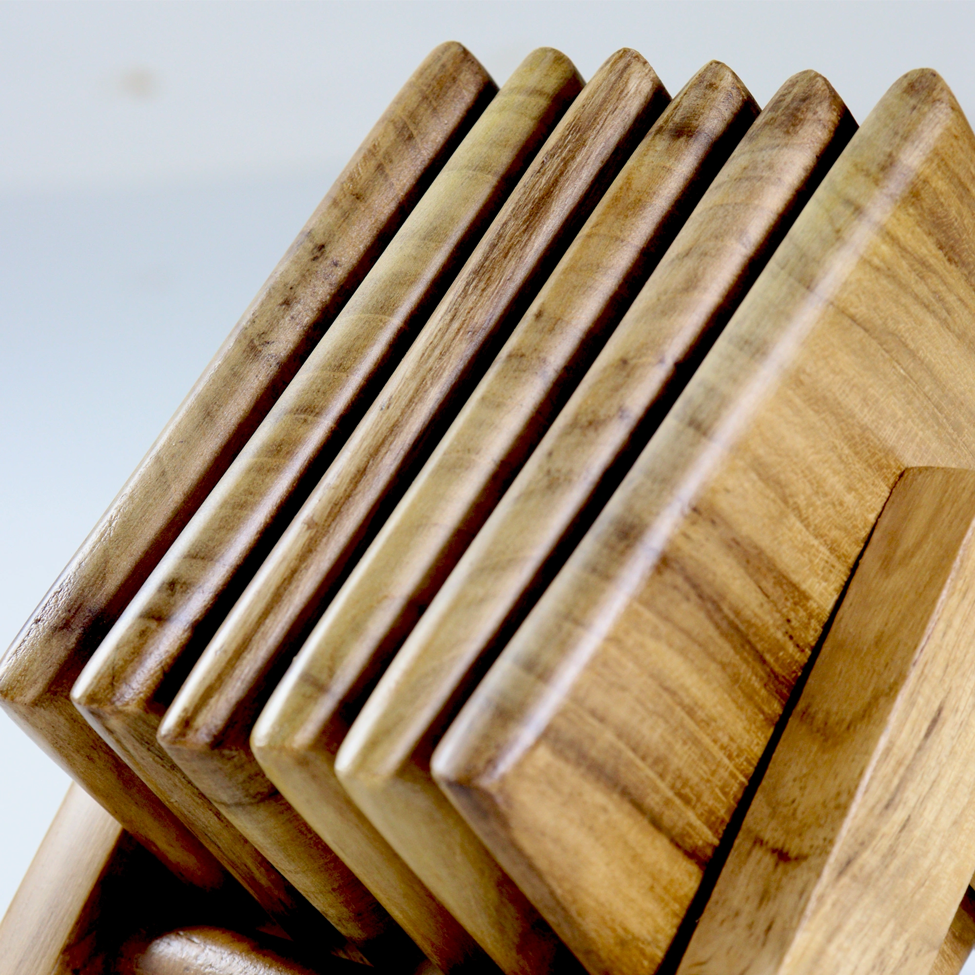 Square wooden tea coasters on a wooden stand