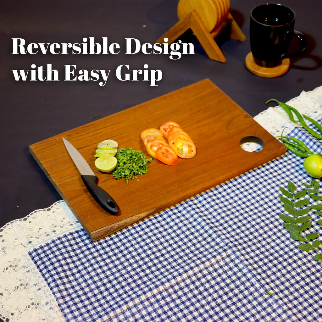 Wooden cutting board with sliced vegetables and a knife on a checkered tablecloth.
