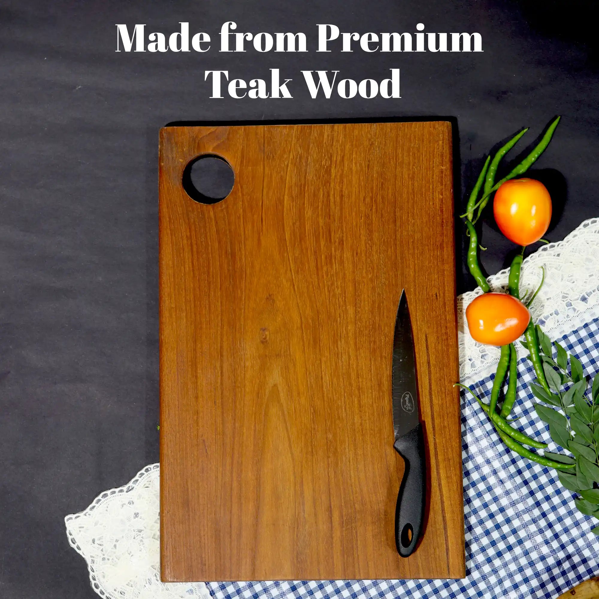 Wooden cutting board with a knife and vegetables on a checkered tablecloth, text 'Made from Premium Teak Wood'.