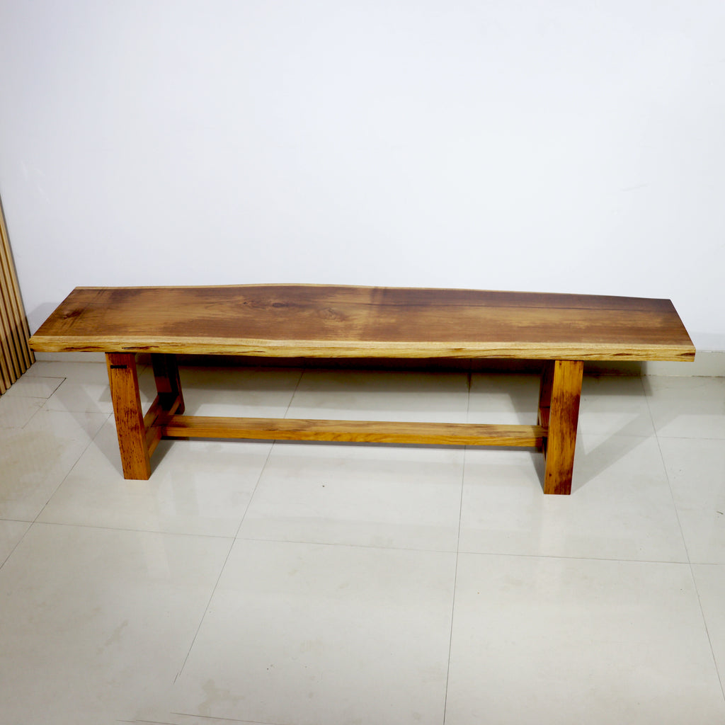 Tarana Solid Wood Long  Bench – 4 Seater against a white wall