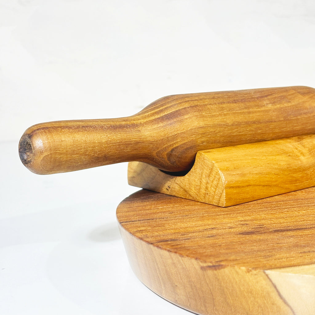 Wooden rolling pin with stand on a white background