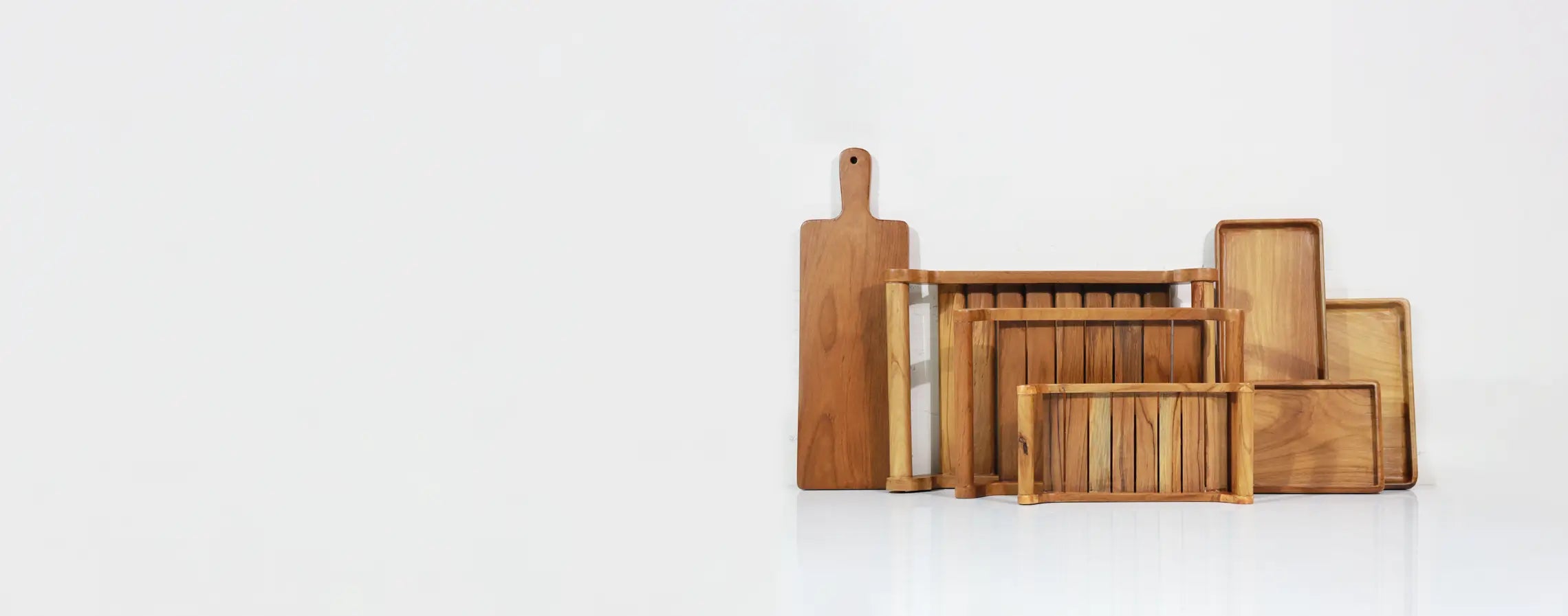 Set of wooden serving trays on a white background