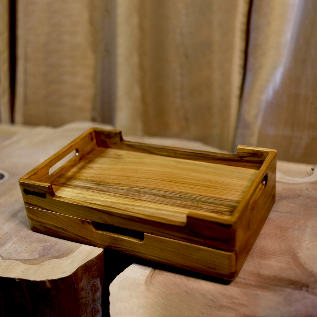 Wooden tray with handles on a textured surface